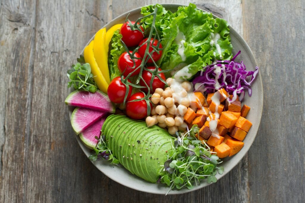 A balanced bowl with vegetables, chickpeas, avocado, and sweet potato, reflecting My Healthy Plate Singapore proportions