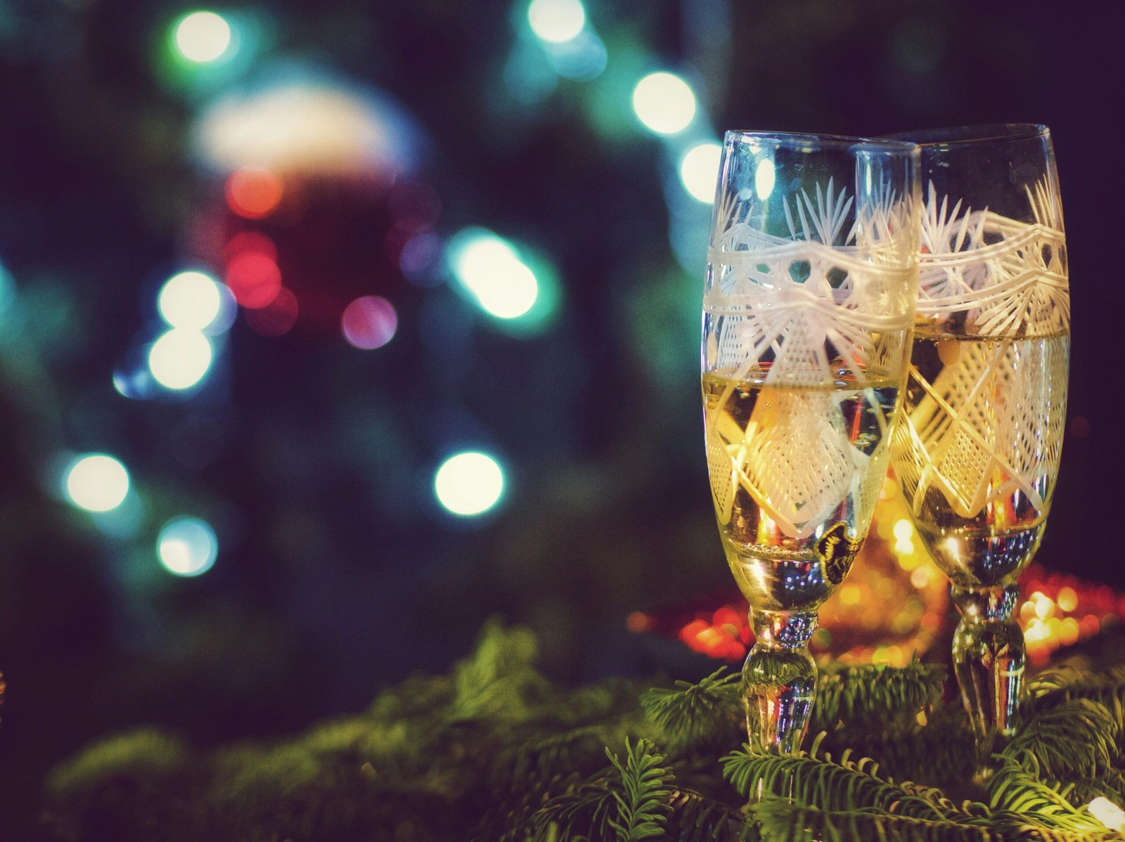 Champagne glasses at a Christmas gathering, a reminder to be cautious with festive alcohol